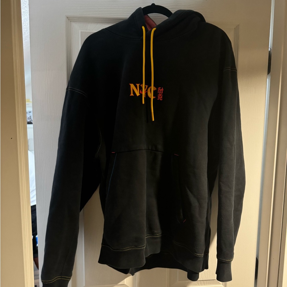 Nike Chinatown Market NYC Black Hoodie with Yellow Accents